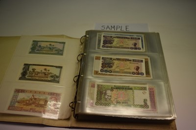Lot 514 - Africa - An album containing mixed banknotes to include issues from Guinea, Central Africa, Zambia, Mauritius, Mozambique, Nigeria, Sierra Leone, Ghana, Algeria, Liberia, Gambia and others to inclu...