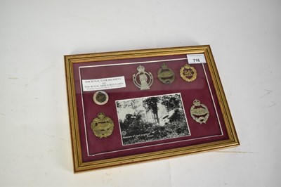 Lot 716 - Group of Royal Armoured Corps and Tank Corps cap badges mounted in glazed frame.