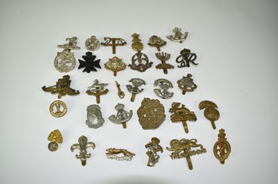 Lot 720 - Collection of thirty military cap badges to include The Royal Sussex Regiment, East Surrey Regiment and Royal West Kent Regiment (30 badges)