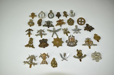 Lot 724 - Collection of thirty military cap badges to include Army Cyclist Corps, Women's Transport Service and Royal Observer Corps (30 badges)