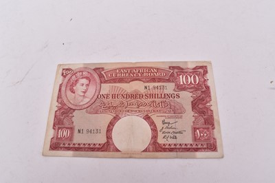 Lot 519 - East Africa - Red on multicolour 100 Shilling banknote N.D. (1958-1960) prefix N.1 (N.B. Rev: with pen marks) otherwise VF (1 banknote)