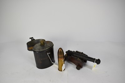 Lot 1016 - Victorian tin gunpowder flask, model cannon and shell