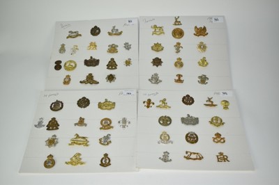 Lot 783 - Four boards mounted with fifty seven military badges to include Royal Army Ordnance Corps, Royal Army Medical Corps and RAF (57 badges)