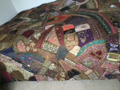 Lot 2125 - Vintage Indian patchwork bed cover with lavish embroidery and beadwork.