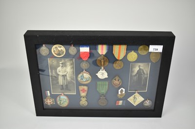 Lot 739 - Group of First World War French medals and commemorative medals to include some scarce paper items, mounted in glazed frame (20 medals)