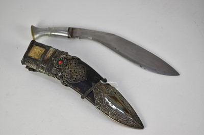Lot 920 - 1940s Presentation 7th Gurkha Regimant Kukri with aluminium hilt with engraved 7th GR badge to pommel, curved blade, ornate yellow and white metal mounted scabbard with inscription ' Presented by S...