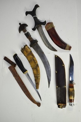 Lot 926 - Two late 19th century Sudanese daggers with scabbards and two other daggers (4)