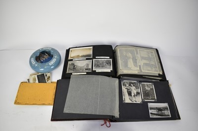 Lot 769 - Two Second World War photograph albums of various scenes of India and military service together with a collection of cloth military badges and a BOAC ashtray.