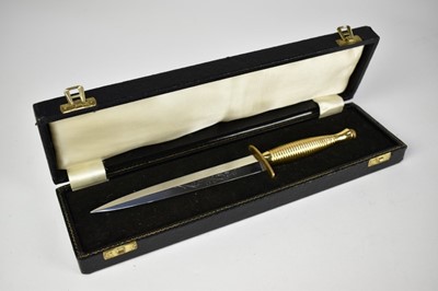Lot 937 - Contemporary third patten presentation Fairbairn Sykes F-S Commando Knife, with ribbed brass hilt, the polished steel blade etched 'A. Wright & Son Ltd, Sheffield, England, in fitted case.
