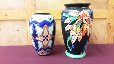 Lot 1365 - Art Deco Crown Ducal vase with brightly painted floral decoration on black ground, 26cm high, together with a pair of Crown Devon vases decorated with galleons, 13.5cm high, Crown Devon Delph vase,...