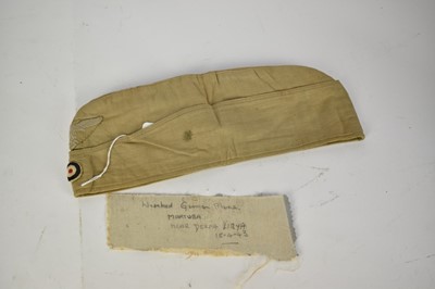 Lot 866 - Second World War Nazi Luftwaffe side cap in North African desert camouflage, with printed label to interior- G. A. Hoffman, 1941.