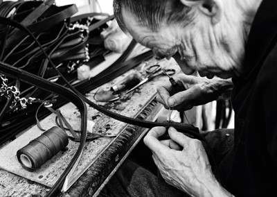 Lot 16 - Jayne Odell black and white photographic print, 'Stitching bridles', 100cm x 71cm