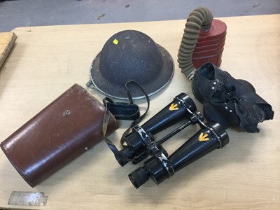 Lot 859 - Pair Second World War British military issue binoculars by Barr & Stroud, together with a tin helmet and a gas mask (3).