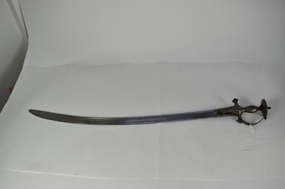 Lot 949 - 19th century Indian Tulwar sword with steel grip, disc pommel and knuckle bow, broard curved fullered blade 96 cm