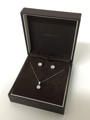 Lot 164 - Diamond cluster pendant necklace and matching earrings, each with a daisy flower head cluster of brilliant cut diamonds in 9ct white gold setting