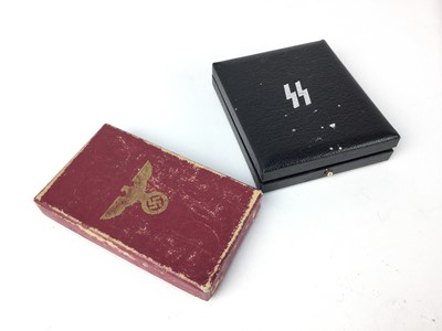 Lot 835 - Two empty Nazi medal boxes, the SS branded one believed to be a Post War copy (2)