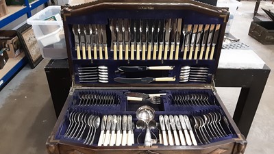 Lot 2529 - Comprehensive canteen of plated cutlery in 1930s oak cabinet with beaded decoration and spiral twist supports