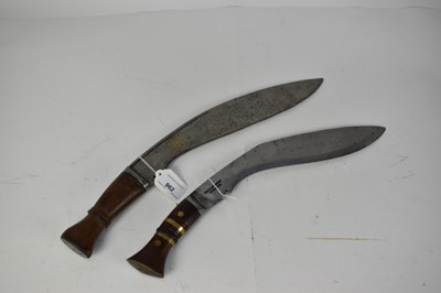 Lot 962 - Early 20th century Gurka military Kukri and post -war Kukri , scabbards lacking (2)