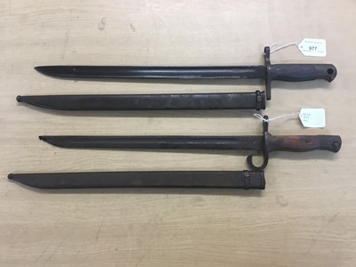 Lot 977 - Two Second World War Japanese bayonets with scabbards (2)