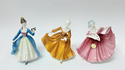 Lot 1386 - Nine Royal Doulton figures - Elaine HN3307, Leading Lady HN2269, Top o' the Hill HN1834, Kirsty HN2381, Olga HN2463, Southern Belle HN2229, Janine HN2481, Autumn Breezes HN1934 and Maureen