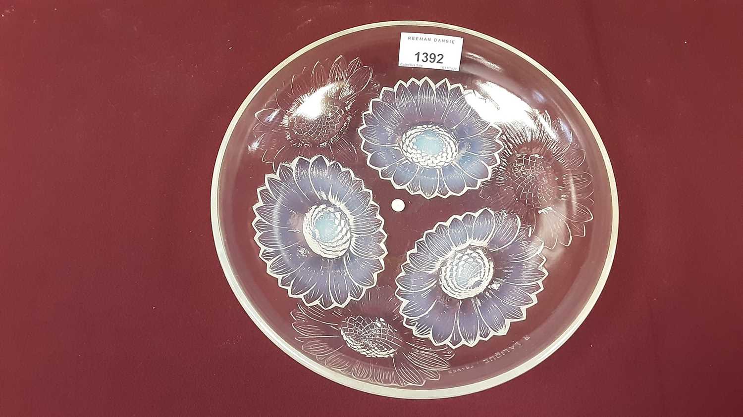 Lot 1392 - Rene Lalique opalescent glass Vernon pattern bowl with moulded Sunflower decoration, signed R Lalique, France, 21.5cm diameter