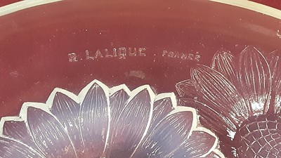 Lot 1392 - Rene Lalique opalescent glass Vernon pattern bowl with moulded Sunflower decoration, signed R Lalique, France, 21.5cm diameter