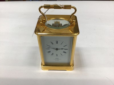 Lot 2576 - A brass cased carriage clock retailed by Dent, with Paris movement, 17cm high with handle up