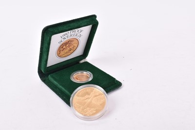 Lot 573 - G.B. - Gold proof Sovereign Elizabeth II 1980 in case of issue with Certificate of Authenticity and Solomon Islands gold plated $25 'Spitfire' coin 2005 (2 coins)
