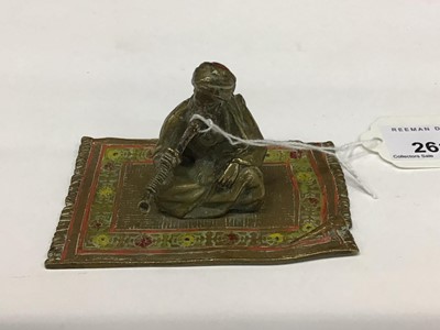 Lot 2613 - Cold painted bronze figure of an Arab man sitting on a rug smoking, probably Austrian