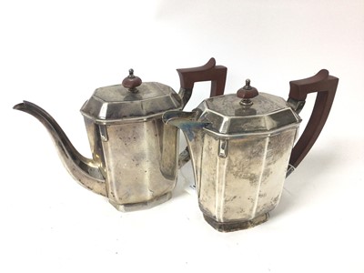 Lot 301 - 1930's silver teapot of faceted oval form with bakelite finial and handle, together with a matching hot water pot, (Sheffield 1935 / 1937), teapot 24.5cm in length, all at 40ozs