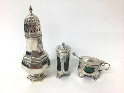 Lot 306 - Edwardian Art Nouveau silver mustard pot with matching spoon and green glass liner, together with a matching pepperette (Birmingham 1904 / 1905) and a silver sugar caster (Birmingham 1972), all at...