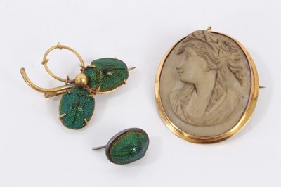 Lot 295 - Egyptian revival yellow metal three leaf clover shaped brooch set with scarab beetles, one other scarab beetle pin and a gold mounted cameo brooch