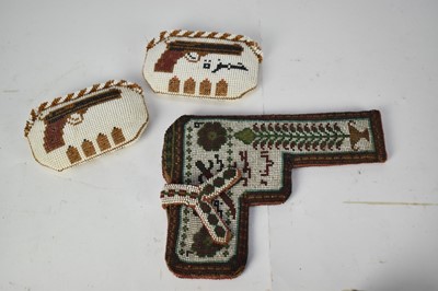Lot 867 - Beadwork holster together with two beadwork purses depicting pistols, manufactured by Syrian Prisioners of War (3)