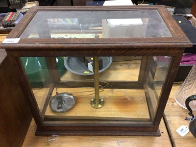 Lot 2688 - Early 20th century brass chemical balance in oak glazed case.