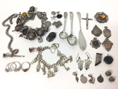 Lot 358 - Group of silver and white metal jewellery including two charm bracelets, gem set rings, brooches, fobs and two teaspoons