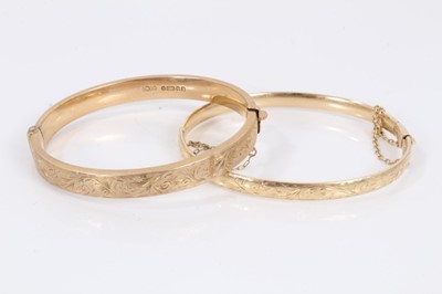 Lot 367 - Two 9ct gold bangles, both with engraved scroll decoration