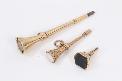 Lot 385 - Victorian yellow metal watch winding key, together with two other Victorian yellow metal seal fobs/ watch winding keys (3)