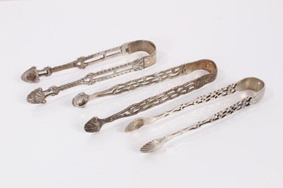 Lot 396 - Three pairs of Georgian and later silver tongs