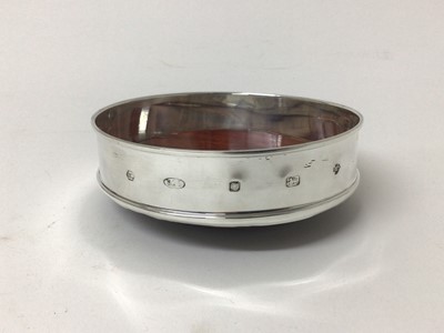 Lot 197 - Silver coaster by Carrs of Sheffield, millennium hallmarks for 2000. Diameter 13cm.