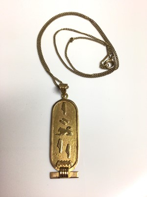 Lot 1 - Egyptian gold pendant on gilt metal chain, 45.5cm long