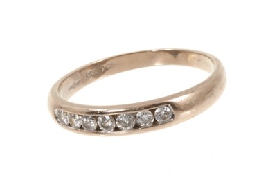 Lot 496 - Diamond eternity ring with seven brilliant cut diamonds in 18ct white gold channel setting