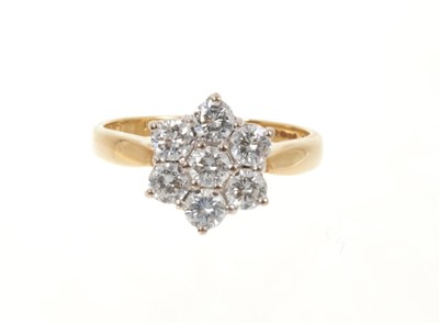 Lot 511 - Diamond cluster ring with a daisy cluster of seven brilliant cut diamonds in claw setting on 18ct yellow gold shank. Estimated total diamond weight approximately 1ct.
