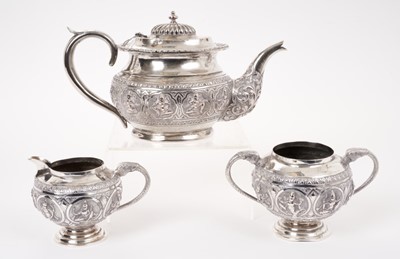Lot 200 - Late 19th century Anglo-Indian white metal three piece tea set