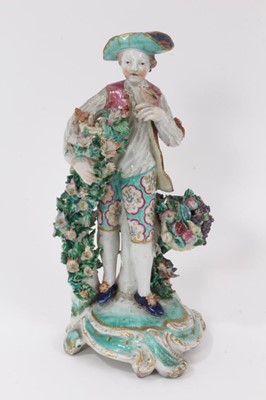Lot 15 - A Bow figure of a young man with flowers and fruits, circa 1765