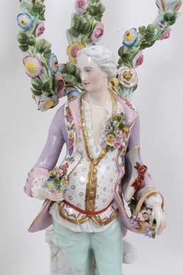 Lot 22 - Pair of Meissen style porcelain figural candlesticks