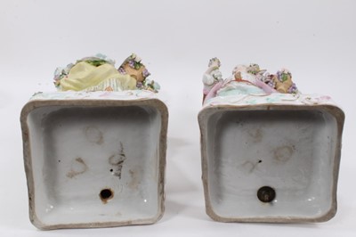 Lot 22 - Pair of Meissen style porcelain figural candlesticks
