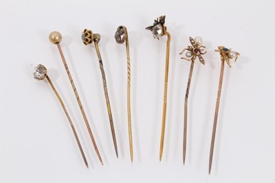 Lot 451 - Seven antique stick pins to include three gold and gem-set novelty insect stick pins