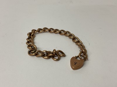 Lot 70 - Late Victorian 9ct rose gold curb link bracelet with heart shaped padlock clasp, (Birmingham 1897).