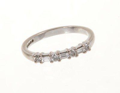 Lot 444 - Diamond eternity ring with a half hoop of brilliant cut and baguette cut diamonds in 18ct white gold setting
