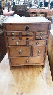 Lot 1026 - Miniature chest with an arrangement of drawers, 31.5cm wide, 23.5cm deep, 40cm high